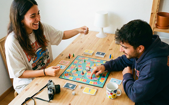 Gen Z playing a board game at an IKEA table